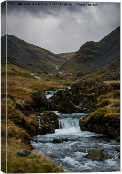 The Enchanting Honister Pass Canvas Print by John Hastings