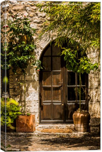 A Shadowy Door in Saint Paul de Vence, France. Canvas Print by Maggie McCall