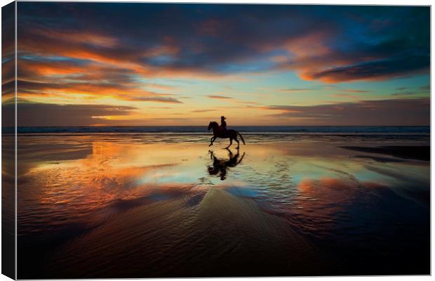 Horse Rider reflections at Widemouth Beach Canvas Print by Maggie McCall