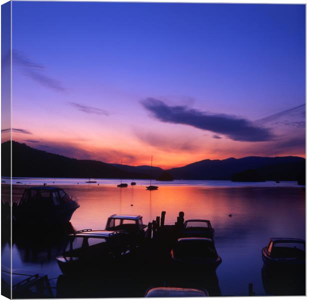 Boat Jetty  at sunset on  Windermere, Cumbria, UK Canvas Print by Maggie McCall