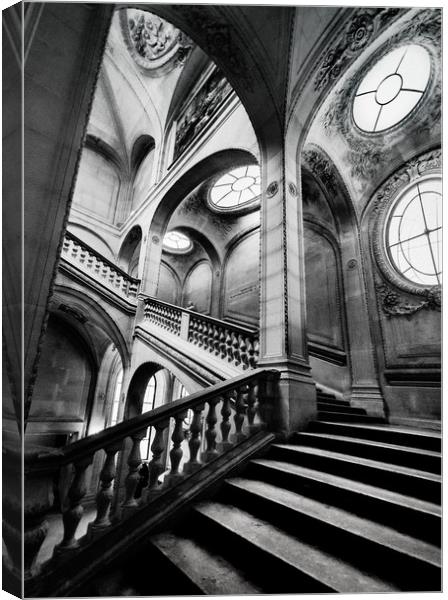 A Stairwell in the Louvre Museum, Paris Canvas Print by Maggie McCall
