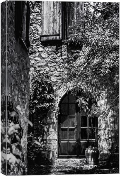 A Shadowy alley in Saint Paul de Vence France Canvas Print by Maggie McCall