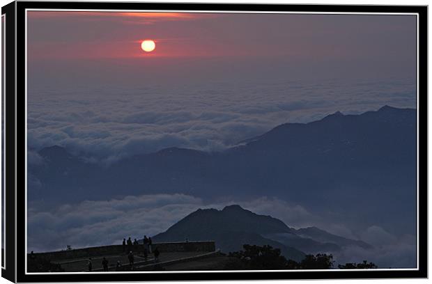 Sunset Above the Clouds Canvas Print by Art Magdaluyo