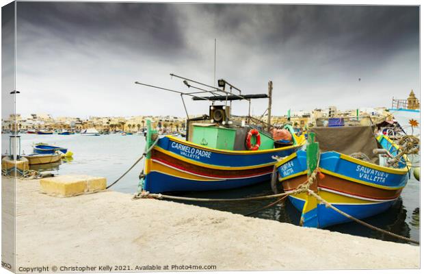 Moored in marsaxlokk bay Canvas Print by Christopher Kelly