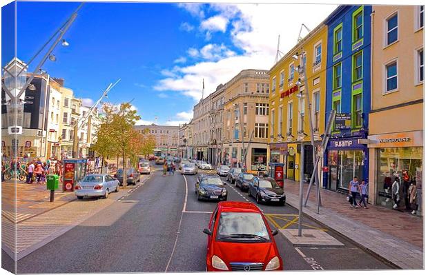  A high street in Cork City Ireland Canvas Print by Sue Bottomley