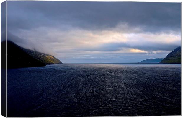  Leaving the Faroe Islands by Sea Canvas Print by Sue Bottomley