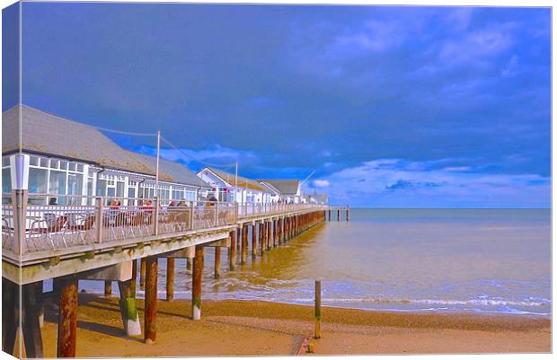 Southwold Pier, beach and sea  Canvas Print by Sue Bottomley