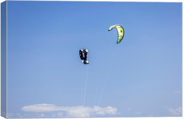 Kites against a blue sky Canvas Print by Phil Crean