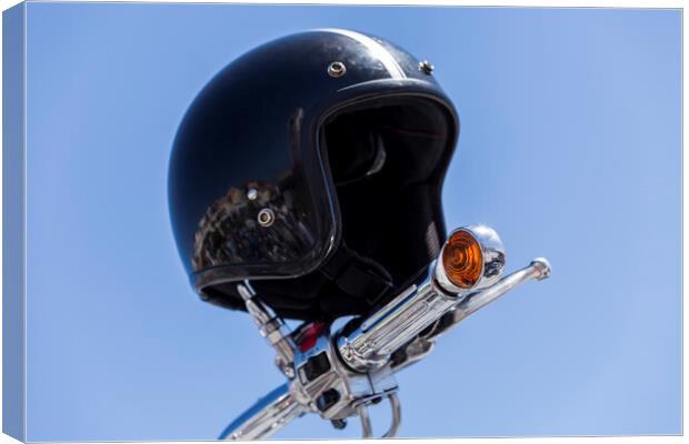Crash helmet on handlebars Canvas Print by Phil Crean