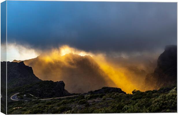 Golden rays of sunshine through the rainclouds Canvas Print by Phil Crean