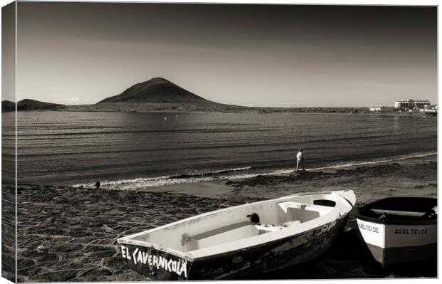 Old boats on the foreshore at El Medano, Tenerife Canvas Print by Phil Crean