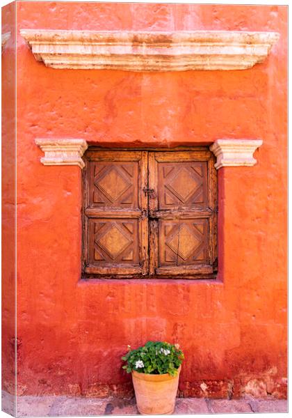 Wooden window shutters, red wall in the Santa Catalina Monastery, Peru Canvas Print by Phil Crean