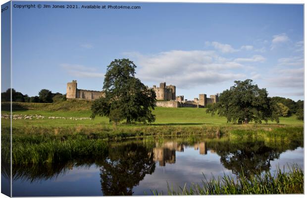 Alnwick Castle reflected in the River Aln (2) Canvas Print by Jim Jones