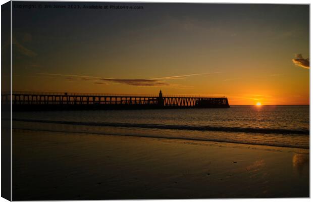 Sunrise and silhouettes Canvas Print by Jim Jones