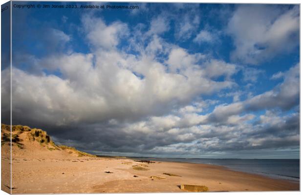 Sunshine and Showers at Druridge Bay Canvas Print by Jim Jones