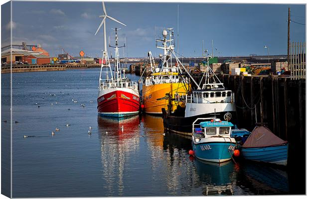 Fishing boats in harbour Canvas Print by Jim Jones