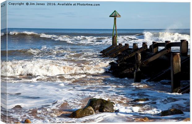 Sunshine on rough sea Canvas Print by Jim Jones