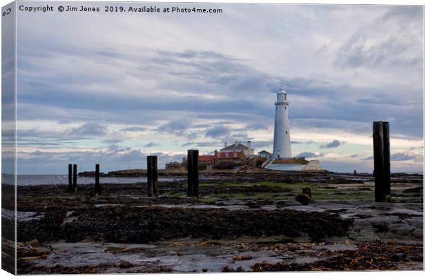St Mary's Island at low tide. Canvas Print by Jim Jones