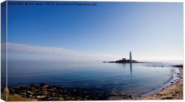 St Mary's Island in a blue haze Canvas Print by Jim Jones