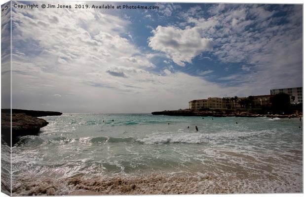 The beach at Cala'n Bosche, Canvas Print by Jim Jones