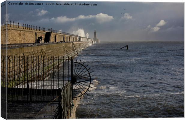 Waves splashing over Tynemouth Pier Canvas Print by Jim Jones