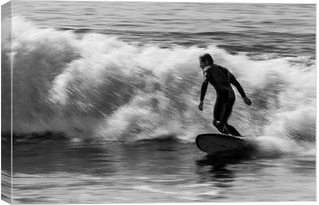 Surfer on a wave Canvas Print by Ian Jones