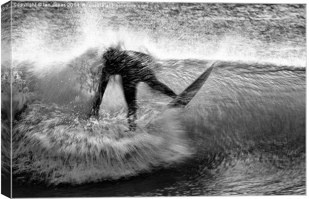  Surfing a beach break Canvas Print by Ian Jones