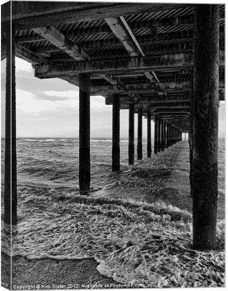Under the Pier Canvas Print by Kim Slater