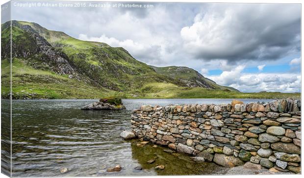 Lake at Idwal Canvas Print by Adrian Evans