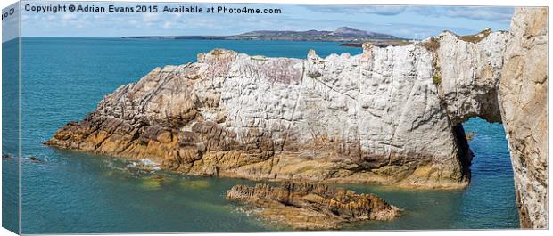 Rhoscolyn Arch Anglesey Canvas Print by Adrian Evans