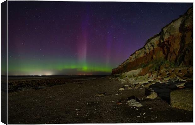 The Northern lights dancing over Hunstanton beach  Canvas Print by Gary Pearson