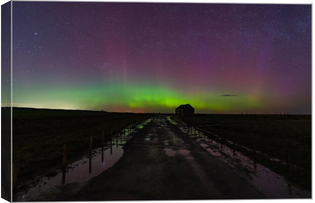 Northern lights dancing over the old coal barn at Thornham  Canvas Print by Gary Pearson