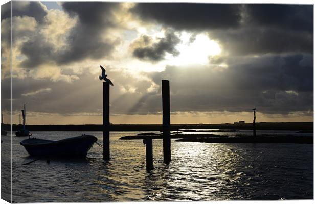 Brancaster Staithe God ray silhouette Canvas Print by Gary Pearson