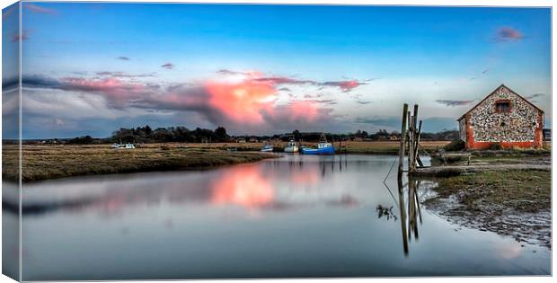 Sunset reflections Thornham Canvas Print by Gary Pearson