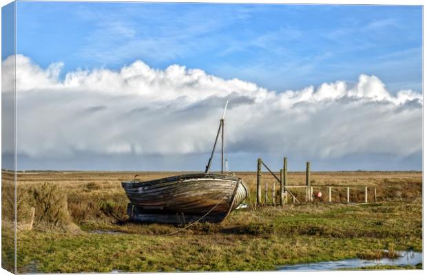 An old boat on Thornham marsh in Norfolk Canvas Print by Gary Pearson
