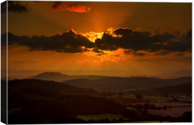 Sunset Over the Mountains Canvas Print by Steven Clements LNPS
