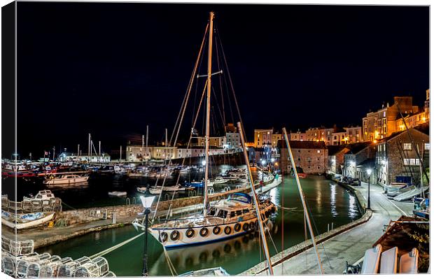  Tenby harbour night time Canvas Print by Paul Deverson