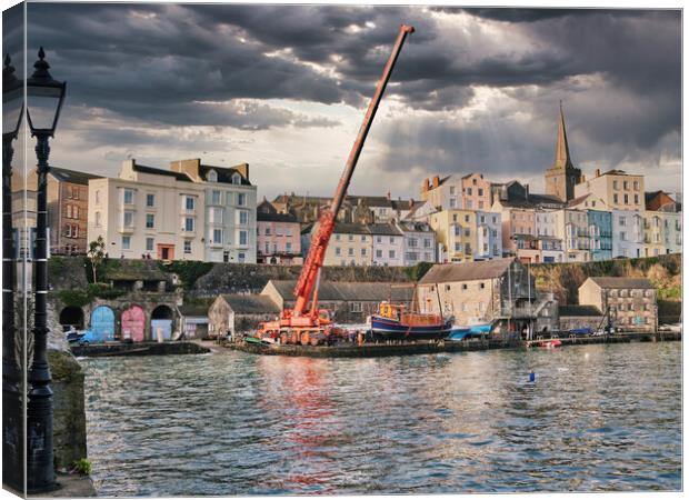 Putting the boats in Tenby Harbour Canvas Print by Paul Deverson