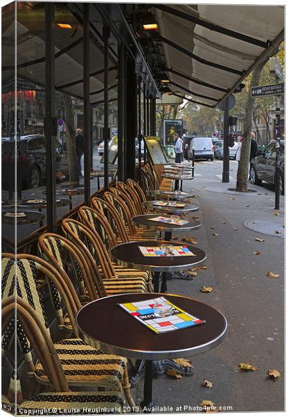 Tables outside a Paris bistro Canvas Print by Louise Heusinkveld