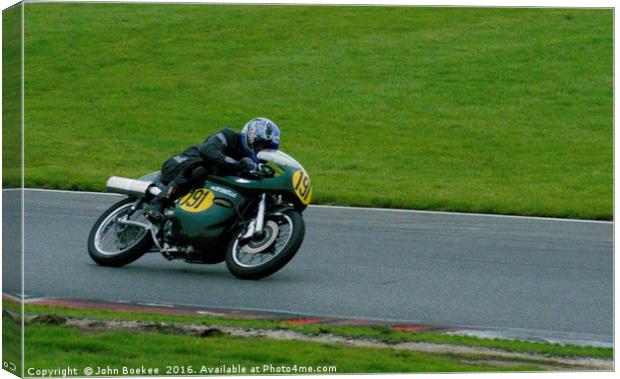 Racing bikes at Snetterton racetrack  Canvas Print by John Boekee