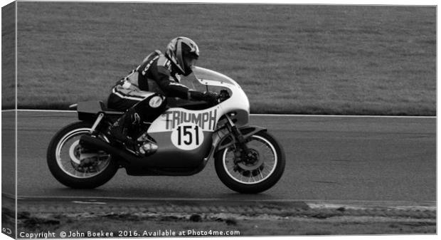 Racing bikes at Snetterton racetrack  Canvas Print by John Boekee