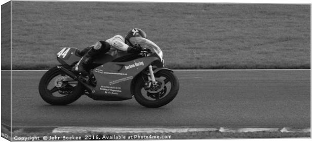 Racing bikes at Snetterton racetrack  Canvas Print by John Boekee