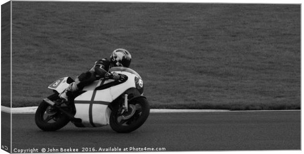 Racing bikes at Snetterton racetrack  Canvas Print by John Boekee