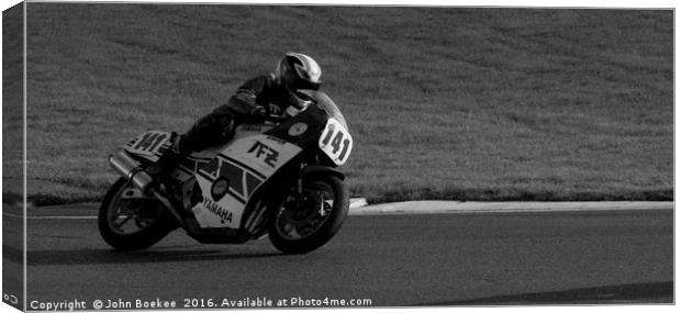 Racing bikes at Snetterton racetrack  Canvas Print by John Boekee