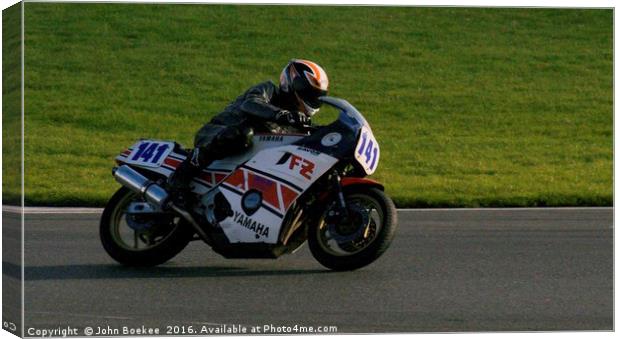 Racing bikes at Snetterton racetrack  Canvas Print by John Boekee