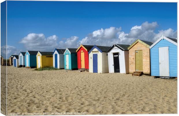 Southwold  Beach Huts on the Sand Canvas Print by Diana Mower