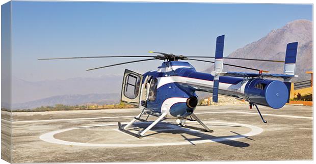 Helicopter ready for takeoff from helipad Canvas Print by Arfabita  