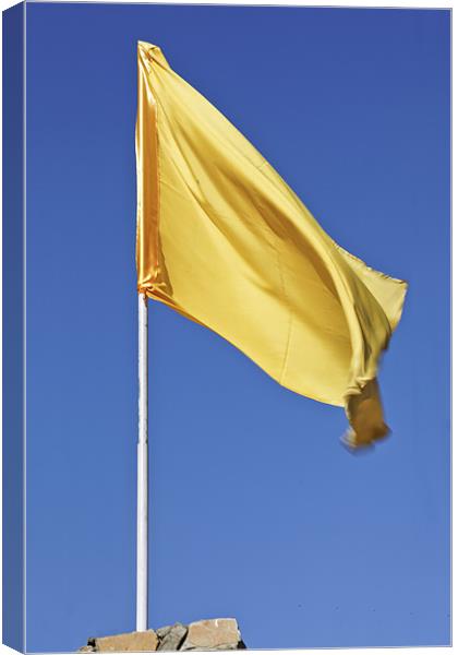 Yellow flag fluttering in blue sky Canvas Print by Arfabita  