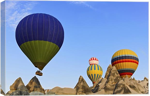 Hot balloons over Cappadocia Terrain Canvas Print by Arfabita  