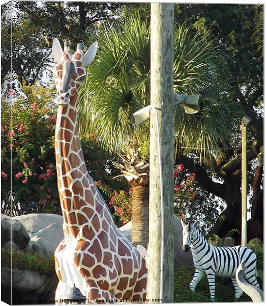 Giraffe and Zebra Statues Canvas Print by Susan Medeiros